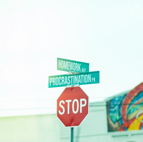 Procrastination street sign.