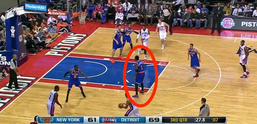 This Knicks player is not playing defense on a Pistons player in the last seconds of the third quarter, leaving him wide open for a three-pointer, while they were losing by eight points.
