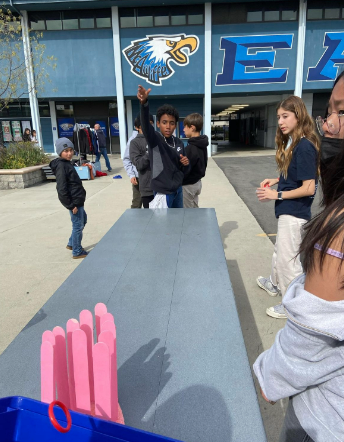 Playing ASB's heart ring toss game.